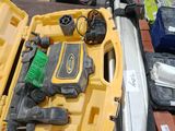 a yellow tool box with tools in it on a table