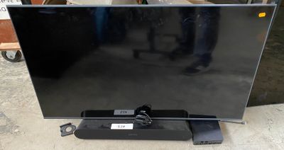 a black flat screen tv sitting on top of a table