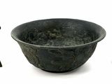a bowl and a vase sitting next to each other on a white surface