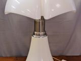 an image of a white table lamp on a wooden table