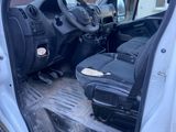an image of the inside of a car with luggage in the back