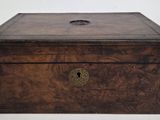 an old wooden box with a latch on the lid