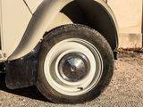 a close up of a car tire on the ground