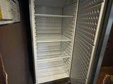 an image of an empty refrigerator in a kitchen