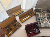 a lot of silverware in a case on a table