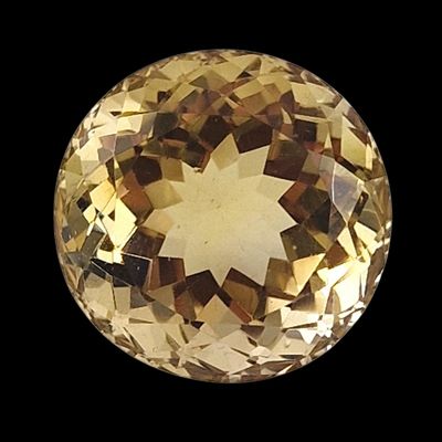 une image représentant un diamant de couleur dorée sur fond noir