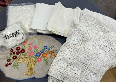 a table with a bunch of cloths on top of it