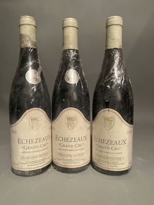 three bottles of wine sitting on top of a table next to each other