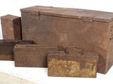 several pieces of old luggage sitting on top of a white table