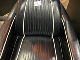 an image of a black and white barber chair
