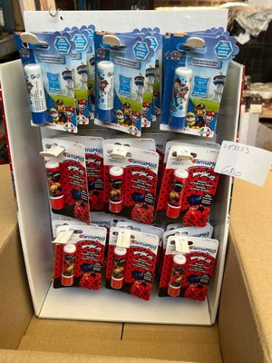 a display of toothbrushes and toothpaste in a cardboard box