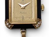 an image of a close up of a watch on a white surface