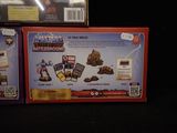 two boxes of action figures that are on display