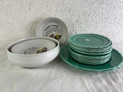 a stack of plates and bowls on a table