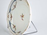 an image of a plate on a stand on a white surface