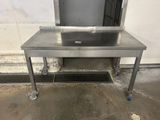 an image of a stainless steel table with a sink on it