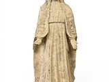 an old statue of a woman wearing a veil and a veiled headdress