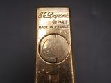 a close up of a gold bar sitting on top of a table