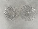 two clear glass dishes sitting on top of a white table