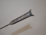 a small metal object with a toothbrush sticking out of it