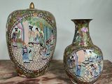two vases that are sitting on a table