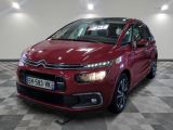 the red citrole is parked on a checkered floor