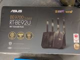 a box of asus wireless routers on the ground