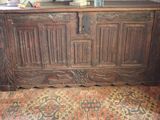 a large wooden chest with carvings on it