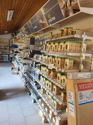 many shelves in the store that have various items on them