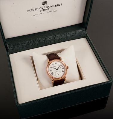 a watch that is in a box on a table