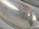 a spoon, fork and spoon rest on the table
