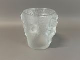 a clear glass cup with a pattern on it