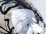 a close up of a helmet with a stick sticking out of it