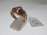 an image of a gold ring with pink and white stones