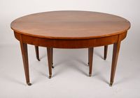 Table ovale en placage de noyer reposant sur huit pieds fuse… (photo 2)