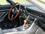 a steering wheel and dashboard of a sports car