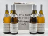 three bottles of white wine in front of a box of white wine