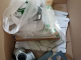 a cardboard box filled with assorted items in it