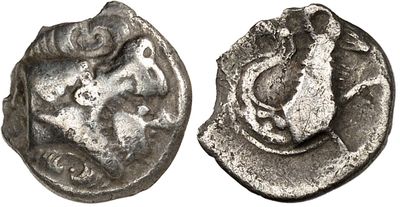 a close up of a silver coin with a bird on it