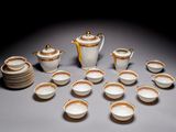 a lot of cups and saucers on the table