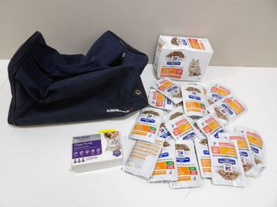 a bag of dog food and a bag of treats on a table