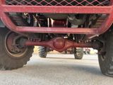 a close up view of the front end of a red truck