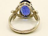 an image of a ring with a blue stone in it