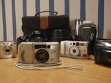 many different types of cameras sitting on a table