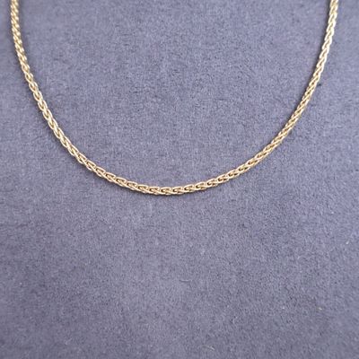 a gold chain necklace on a mannequin mannequin mannequin mannequin mannequin mannequin mannequin mannequin manne