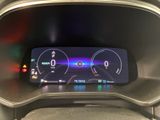the dashboard of a car with a digital display in the center