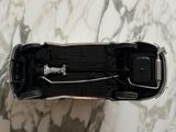 a toy car that is sitting on a marble table