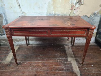a wooden table with two drawers on it on a wooden floor