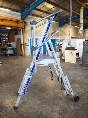 a ladder that is sitting in the middle of a room