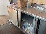 a stainless steel counter in a kitchen with a box on it